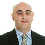 a professional headshot of Zurab Moshashvili, Partner and CPA at Anchin